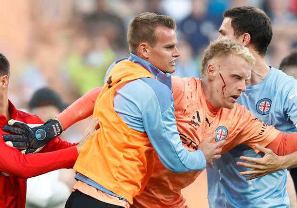 Violent Pitch Invasion: Goalkeeper Attacked As Melbourne A-League Derby Abandoned(Video)
